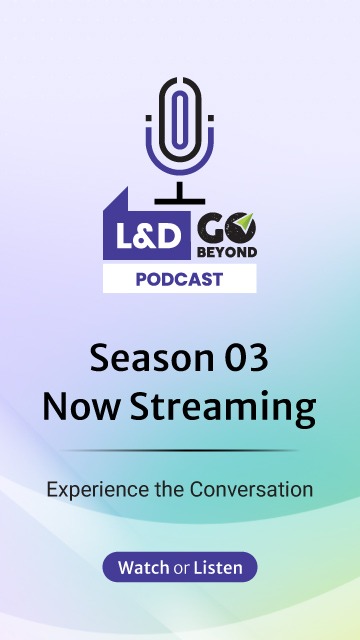 Man in glasses working on a laptop at a desk with documents and a plant, next to text promoting Upside Learning’s eBook “Beyond Training: An Actionable Guide to Learning That Delivers Measurable Business Impact,” with a Download Now button.